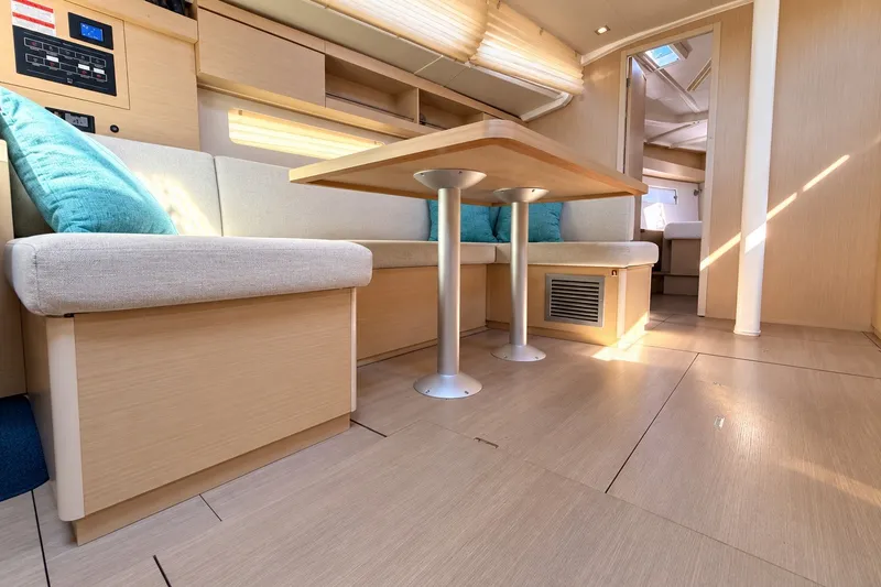 Slide: The Image of Interior of 2022 Beneteau Oceanis 40.1 yacht, featuring modern seating and dining area. - 8