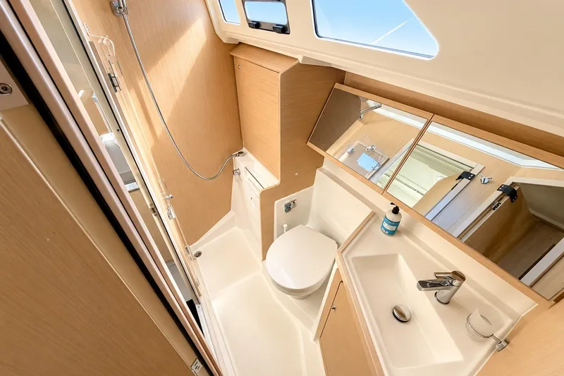 Slide: The Image of Modern bathroom interior of 2022 Beneteau Oceanis 40.1 yacht, featuring sleek design and fixtures. - 25