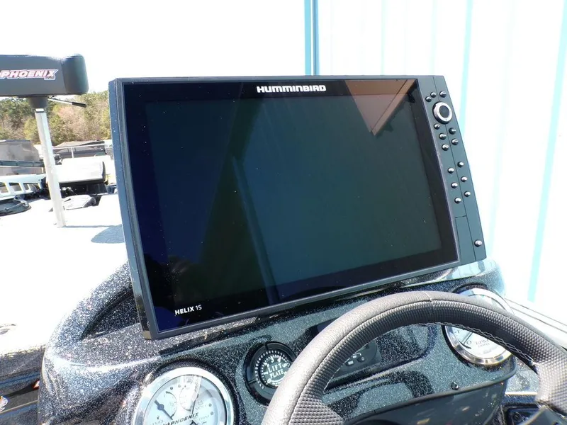 Slide: The Image of Helix 15 fishfinder on Phoenix 920 Elite 2025 boat dashboard. - 13