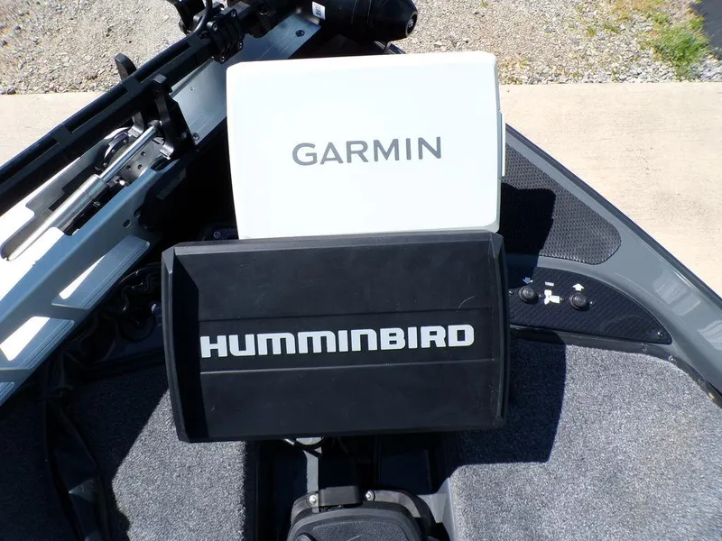 Slide: The Image of Garmin and Humminbird devices on a 2025 Phoenix 920 Elite boat dashboard. - 14