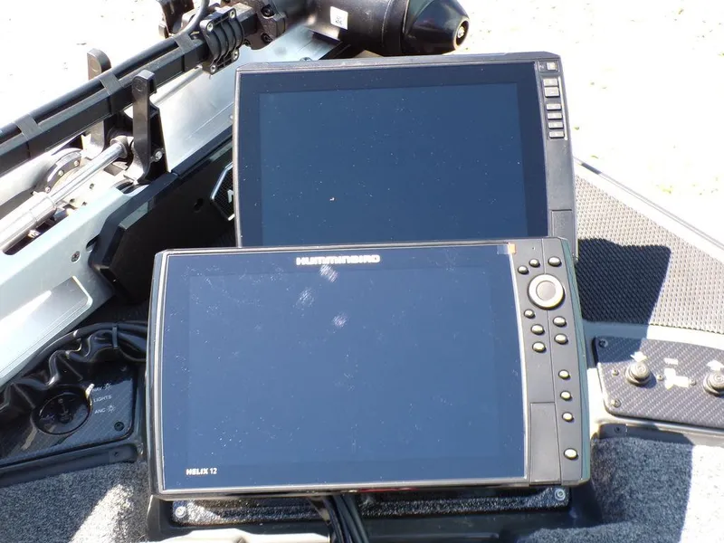 Slide: The Image of Two electronic displays on a Phoenix 920 Elite boat, 2025 model. - 15