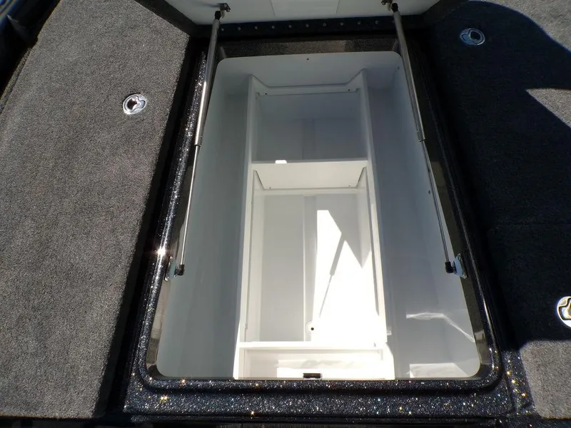 Slide: The Image of Open storage compartment in 2025 Phoenix 920 Elite boat, featuring spacious interior design. - 16