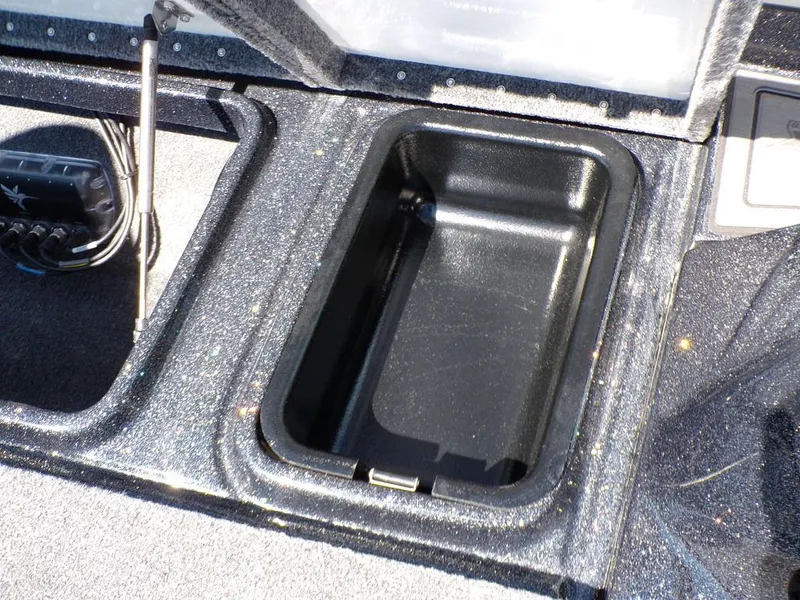 Slide: The Image of Open storage compartment in 2025 Phoenix 920 Elite boat. - 19