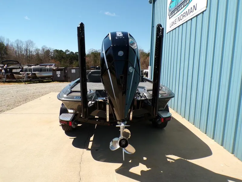 Slide: The Image of 2025 Phoenix 920 Elite boat, rear view, parked near Lake Norman facility. - 5