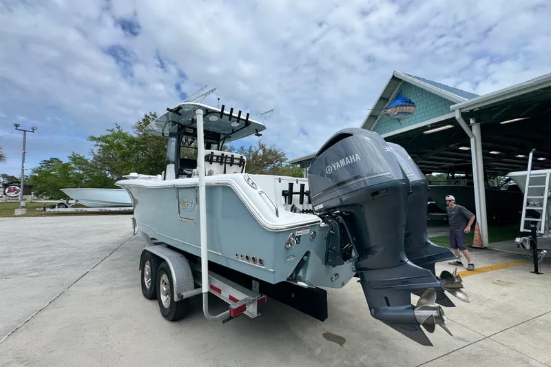 Slide: The Image of 2020 Sea Hunt Gamefish 30 boat with Yamaha engines on a trailer. - 14