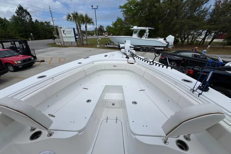 Slide: The Image of 2020 Sea Hunt Gamefish 30 Forward Seating boat displayed outdoors. - 17