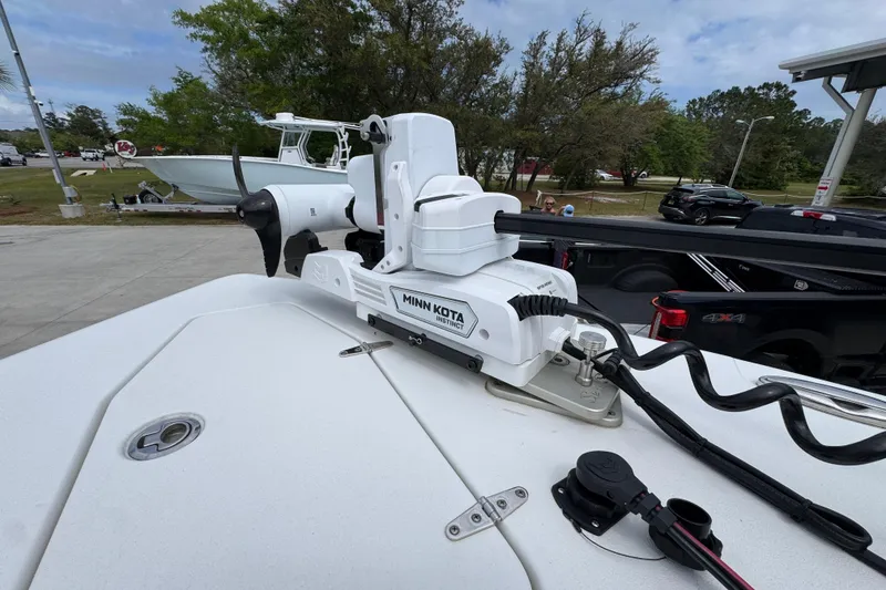 Slide: The Image of 2020 Sea Hunt Gamefish 30 with Minn Kota trolling motor, parked outdoors. - 19