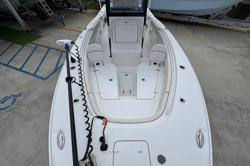 Slide: The Image of 2020 Sea Hunt Gamefish 30 Forward Seating boat, featuring spacious deck and seating area. - 20