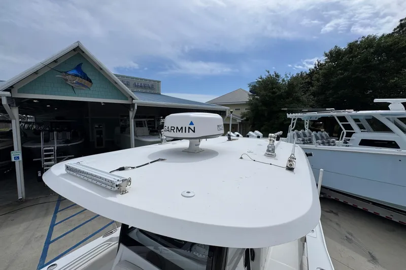 Slide: The Image of 2020 Sea Hunt Gamefish 30 with Garmin radar at a marina. - 23