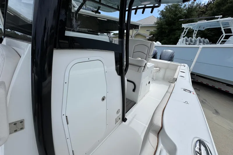 Slide: The Image of 2020 Sea Hunt Gamefish 30 boat with forward seating, showcasing sleek design and spacious interior. - 24
