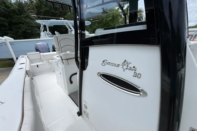 Slide: The Image of 2020 Sea Hunt Gamefish 30 boat with forward seating, showcasing sleek interior design. - 25