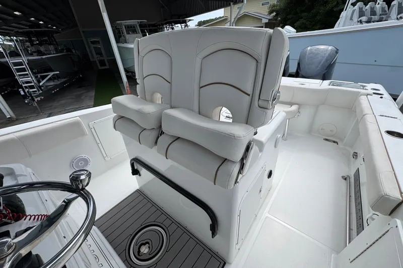 Slide: The Image of 2020 Sea Hunt Gamefish 30 boat interior with forward seating and steering wheel. - 26
