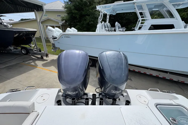 Slide: The Image of 2020 Sea Hunt Gamefish 30 with twin Yamaha 300 engines, parked on a trailer. - 39