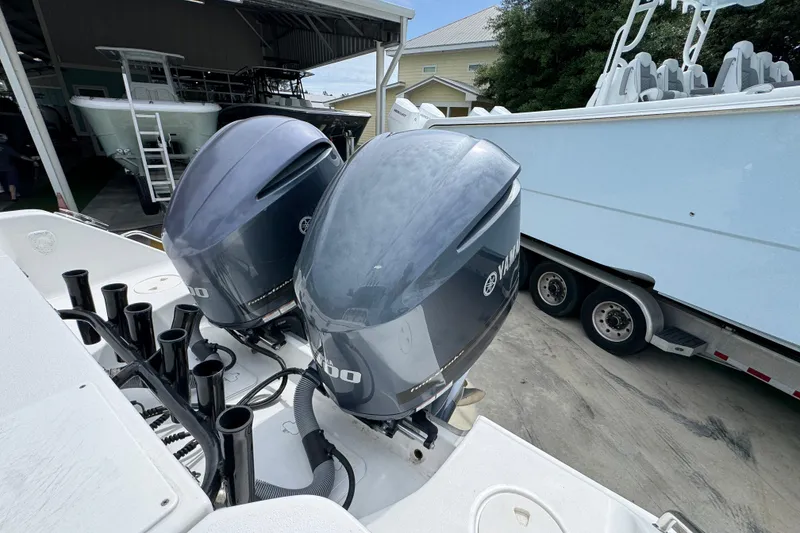 Slide: The Image of Twin Yamaha outboard engines on a 2020 Sea Hunt Gamefish 30 boat in a marina. - 40
