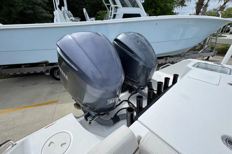 Slide: The Image of 2020 Sea Hunt Gamefish 30 with twin Yamaha outboard engines, docked on a trailer. - 41