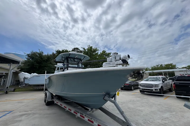 Slide: The Image of 2020 Sea Hunt Gamefish 30 boat on trailer under cloudy sky. - 7
