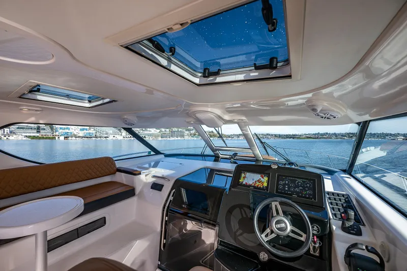 Slide: The Image of Interior view of 2006 Tiara Yachts 4000 Sovran, featuring helm and seating area. - 25