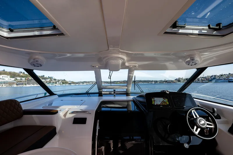Slide: The Image of Interior view of 2006 Tiara Yachts 4000 Sovran helm with panoramic water view. - 32