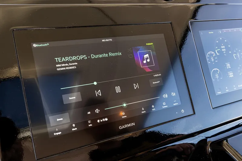 Slide: The Image of Garmin display on 2006 Tiara Yachts 4000 Sovran showing music controls and gauges. - 42