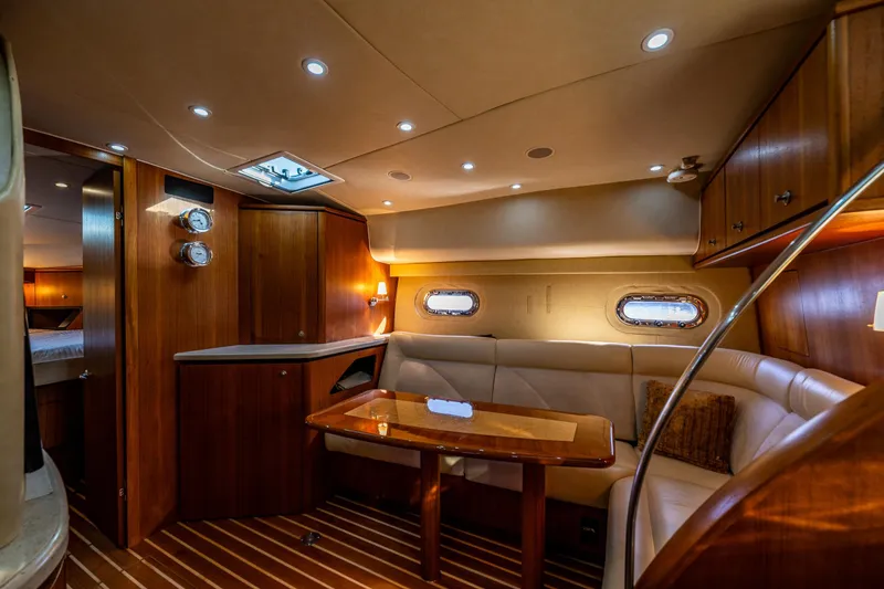 Slide: The Image of Luxurious 2006 Tiara Yachts 4000 Sovran interior with elegant wood finishes and cozy seating. - 43