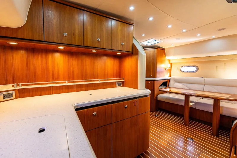 Slide: The Image of Luxurious interior of 2006 Tiara Yachts 4000 Sovran with wood cabinetry and plush seating. - 47