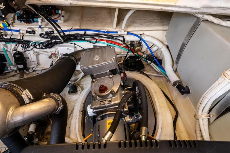 Slide: The Image of Upper pod drives of a 2006 Tiara Yachts 4000 Sovran, showcasing mechanical components and wiring. - 58