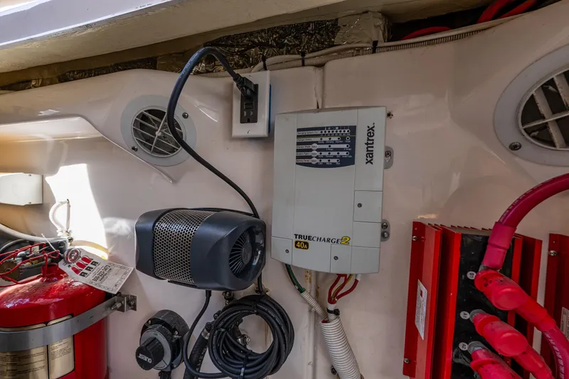 Slide: The Image of Electrical components in a 2006 Tiara Yachts 4000 Sovran, featuring a Xantrex TrueCharge2 charger. - 62