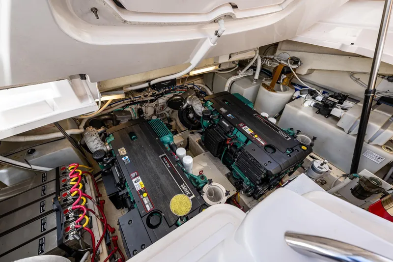 Slide: The Image of Engine room of 2006 Tiara Yachts 4000 Sovran, showcasing dual engines and battery setup. - 64