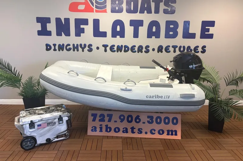 The Image of Inflatable Caribe L-8 boat with Tohatsu motor, displayed at AI Boats showroom. - 0