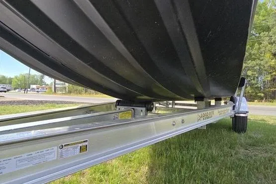 Slide: The Image of 2026 Havoc 1760 VJST boat on trailer, side view, parked on grass. - 2