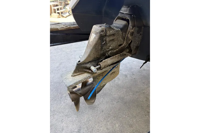 Slide: The Image of Outboard motor of a 2002 Cobalt 240 boat with visible wear and barnacles. - 13