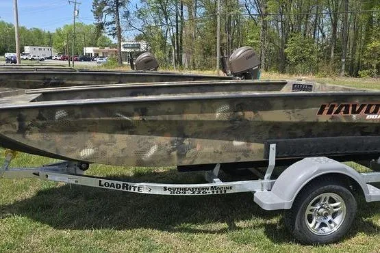 The Image of 2026 Havoc 1553 VJST boat on Load Rite trailer, parked on grass. - 0