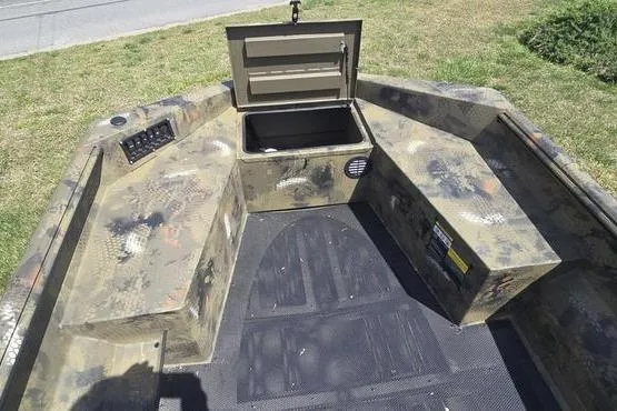 Slide: The Image of Interior of a 2026 Havoc 1553 VJST boat with camo design and storage compartment. - 7