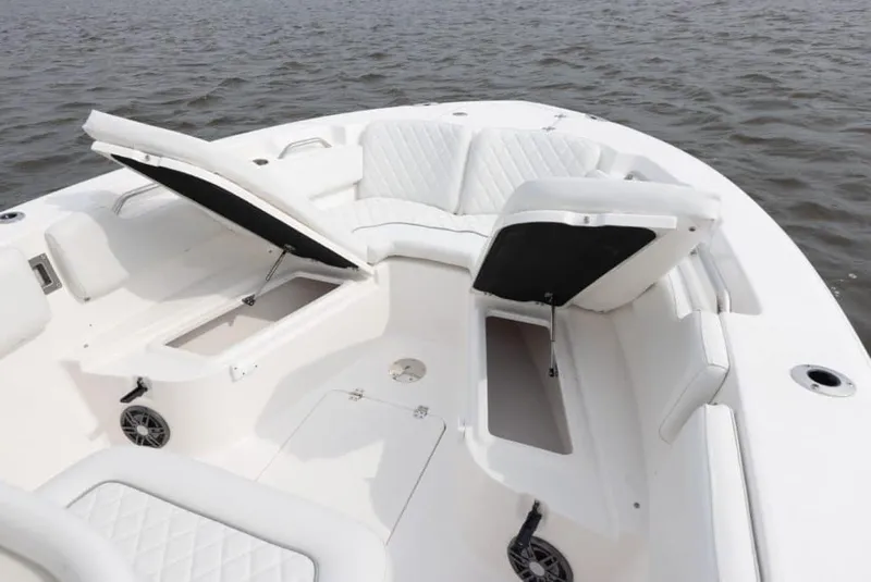 Slide: The Image of Manufacturer Provided Image: 2025 Sea Fox 248 Commander boat with open storage compartments on calm water. - 11
