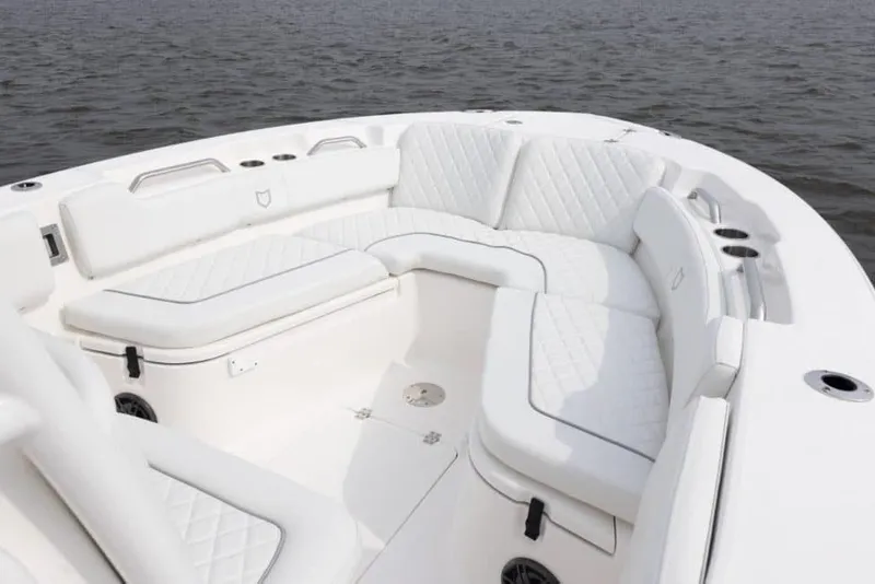 Slide: The Image of Manufacturer Provided Image: Luxurious seating on 2025 Sea Fox 248 Commander boat, featuring white cushioned interior. - 12
