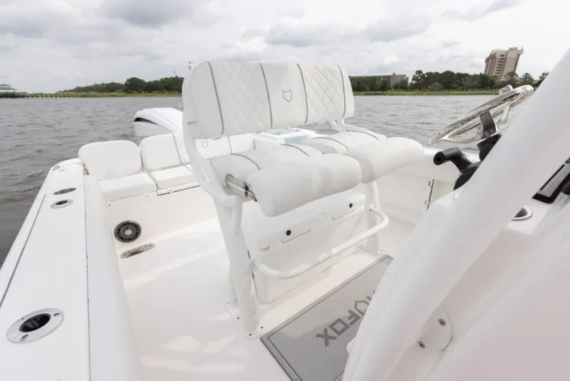 Slide: The Image of Manufacturer Provided Image: 2025 Sea Fox 248 Commander boat interior with white seating and steering wheel. - 15