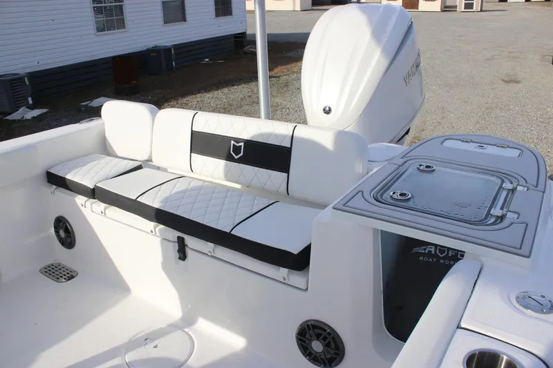Slide: The Image of 2026 Sea Fox 248 Commander boat interior with cushioned seating and Yamaha engine. - 3