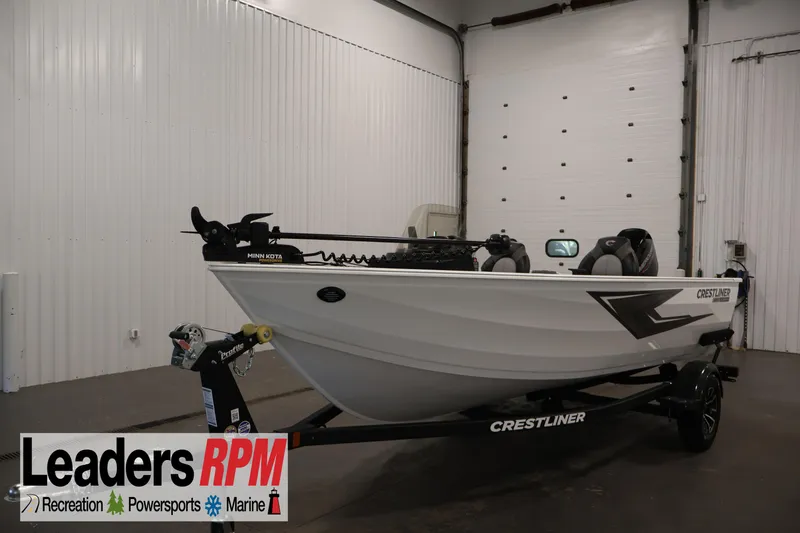 The Image of 2026 Crestliner 1650 Kodiak SC boat in showroom, featuring Minn Kota trolling motor. - 5