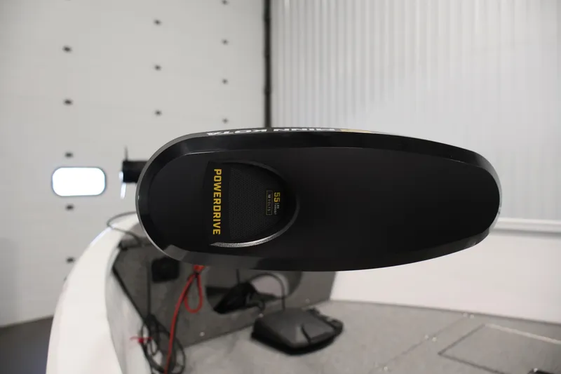 Slide: The Image of 2026 Crestliner 1650 Kodiak SC boat with PowerDrive motor in a garage setting. - 16