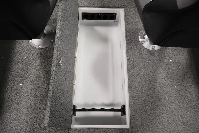 Slide: The Image of 2026 Crestliner 1650 Kodiak SC boat interior storage compartment with open lid. - 34