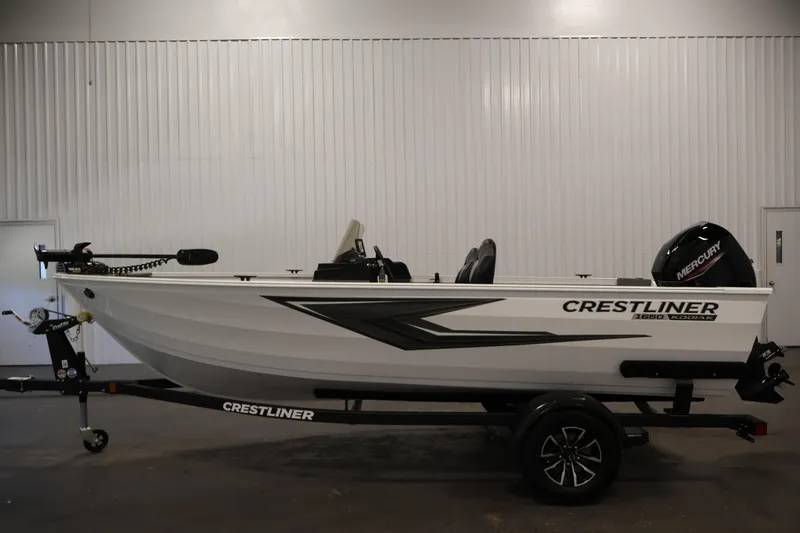 Slide: The Image of 2026 Crestliner 1650 Kodiak SC fishing boat on trailer in indoor setting. - 12