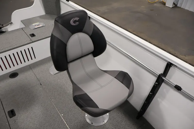 Slide: The Image of 2026 Crestliner 1650 Kodiak SC boat seat, gray and black design, interior view. - 32