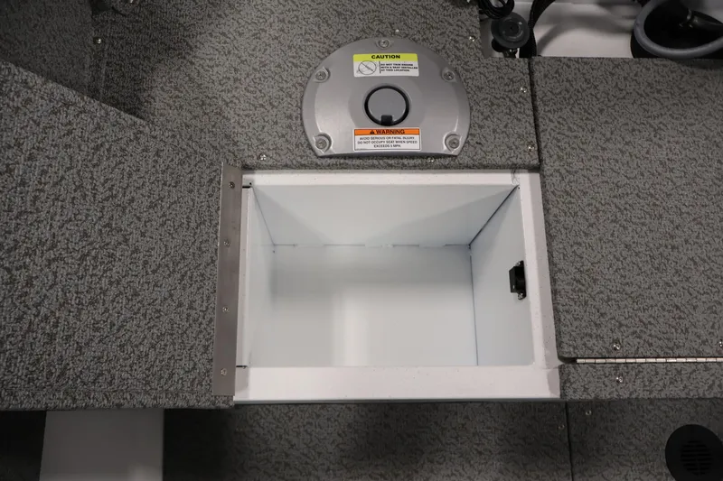 Slide: The Image of Open storage compartment in 2026 Crestliner 1650 Kodiak SC boat interior. - 36