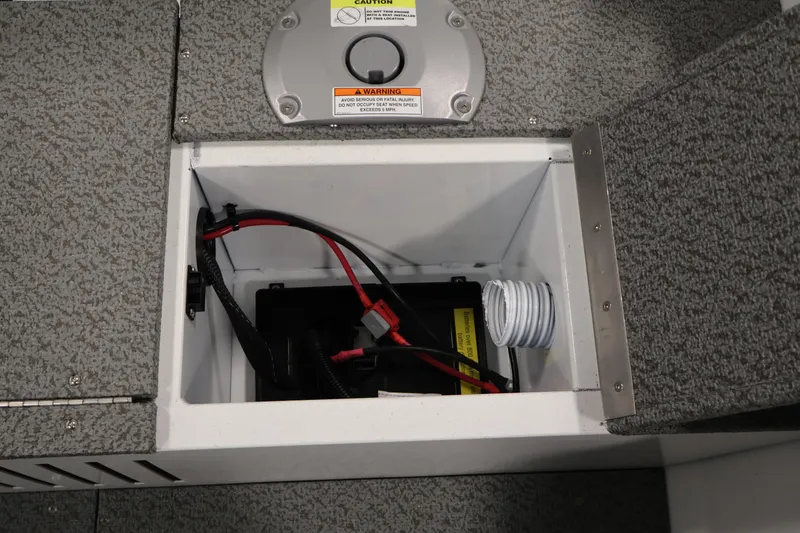 Slide: The Image of Battery compartment of 2026 Crestliner 1650 Kodiak SC boat, featuring wiring and ventilation. - 37