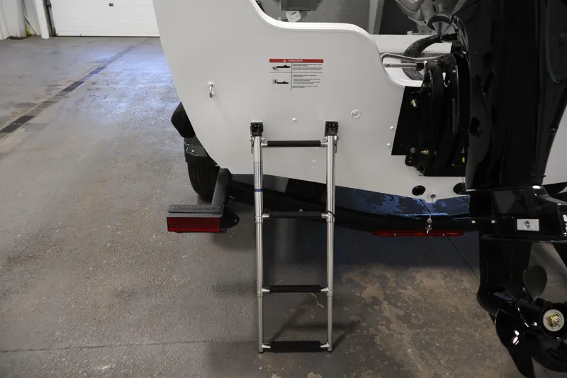 Slide: The Image of Rear view of 2026 Crestliner 1650 Kodiak SC boat with ladder and motor. - 38