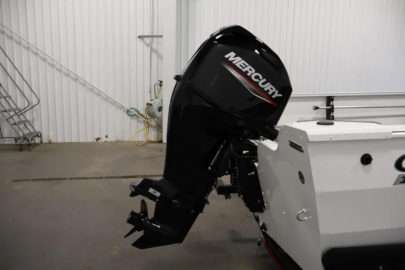 Slide: The Image of 2026 Crestliner 1650 Kodiak SC with Mercury outboard motor in a garage setting. - 40