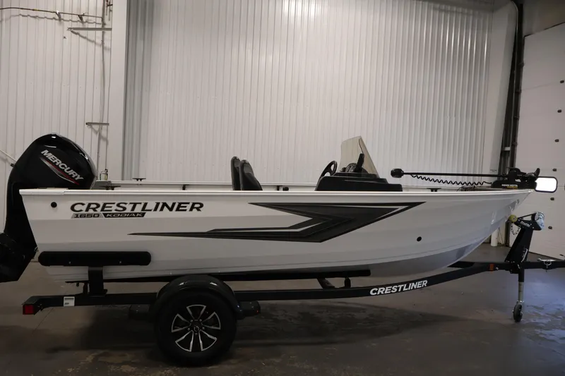 Slide: The Image of 2026 Crestliner 1650 Kodiak SC fishing boat in a showroom, side view. - 8