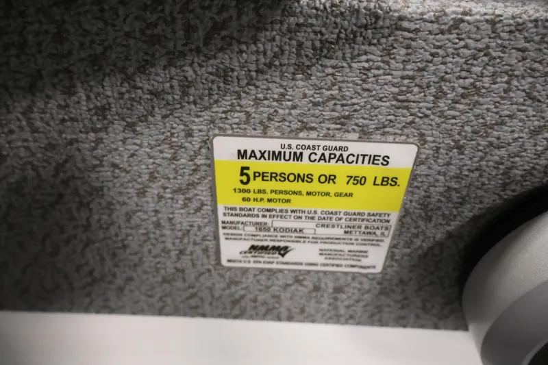 Slide: The Image of 2026 Crestliner 1650 Kodiak SC capacity label, 5 persons or 750 lbs, 60 HP motor. - 30