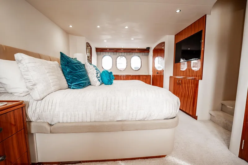 Slide: The Image of Luxurious bedroom interior of 2012 Hatteras 80 Motor Yacht with elegant wood finishes. - 104