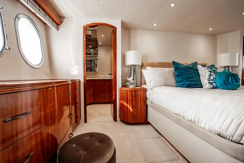 Slide: The Image of Luxurious bedroom interior of 2012 Hatteras 80 Motor Yacht with elegant wood furnishings. - 105